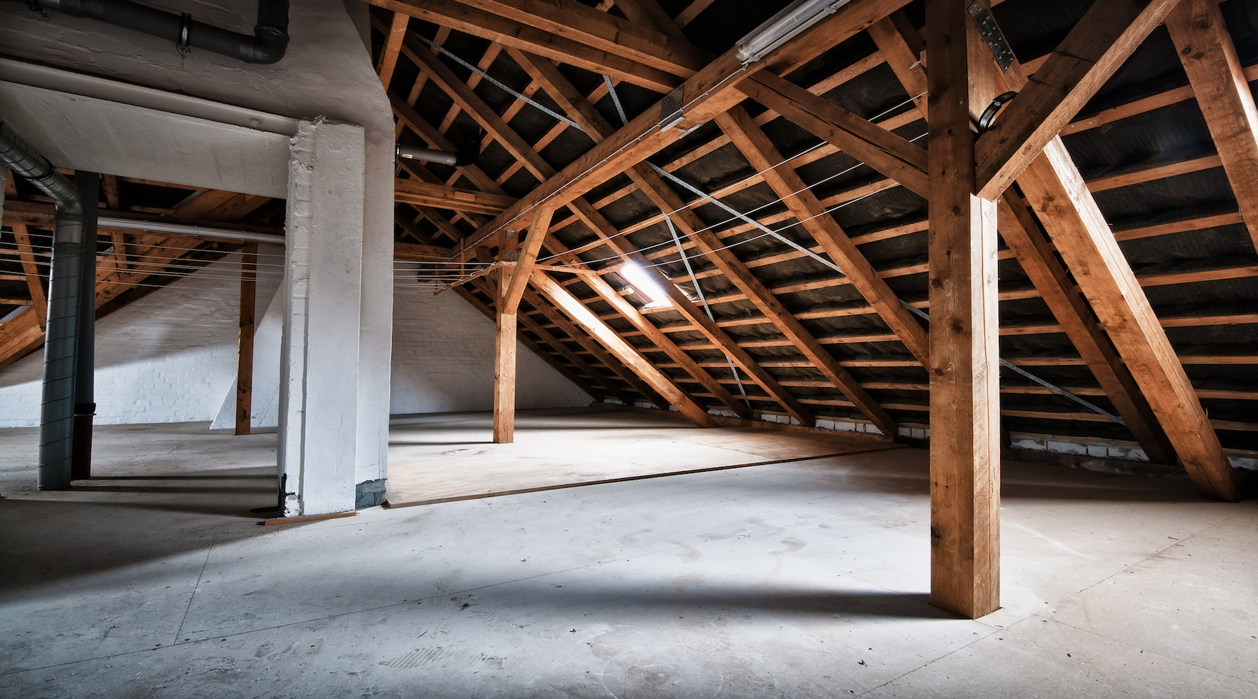 Attic lighting installed in empty house attic