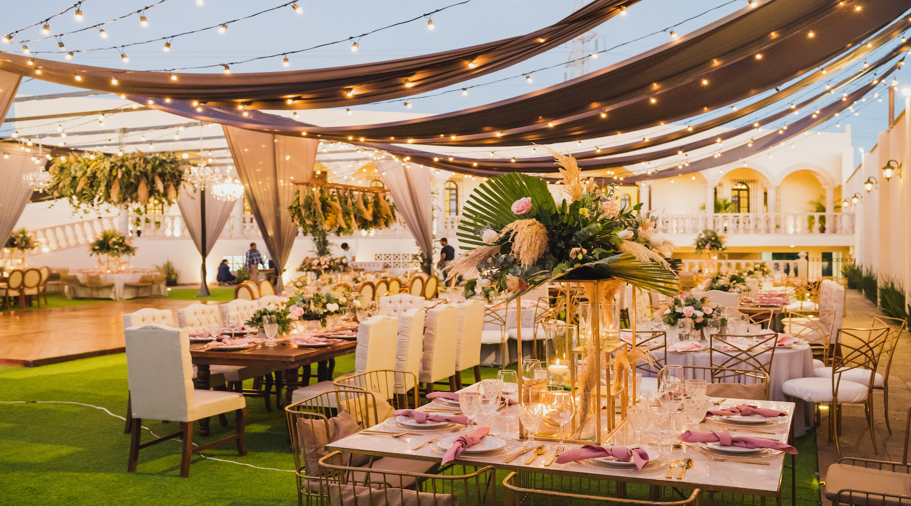 Event lighting shown illuminating a beautiful outdoor wedding event reception area