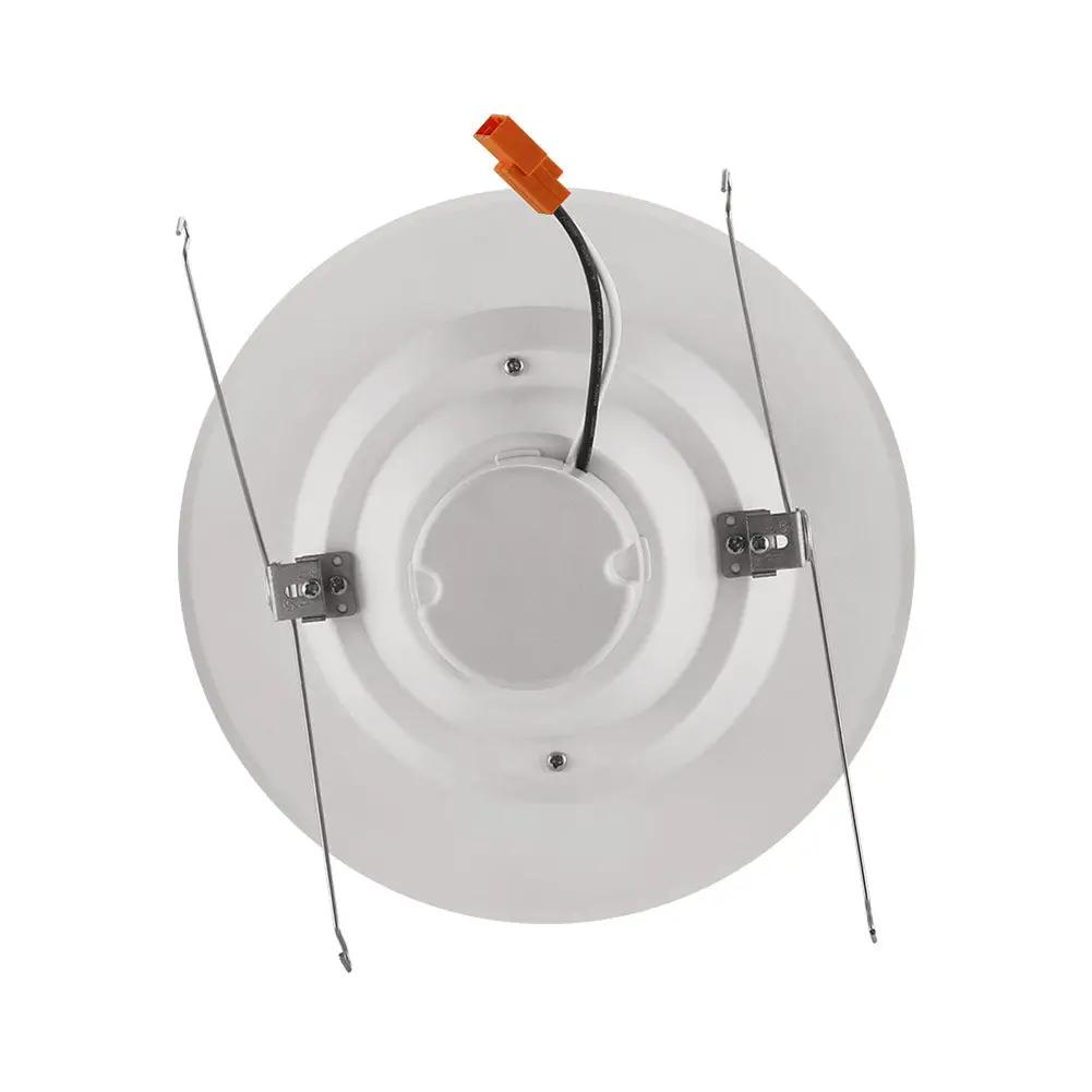 A white round LED recessed lighting retrofit conversion kit with wires, providing 840 lumens of light output. 6" diameter, 12 Watts, dimmable, wet location rated. 5-year warranty.