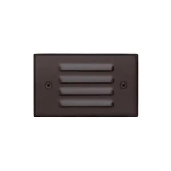 A close-up of a landscape step lighting fixture by Sollos Lighting. This outdoor stairway accent and safety light has a textured black or bronze finish, measures 4.8"W x 2.6"D, and is dimmable. Bulb type: T3, 20W, 12V. ETL Listed, wet location rated. Lifetime warranty.