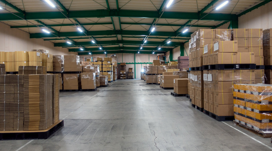 High bay lights shown in warehouse with pallets containing cartons