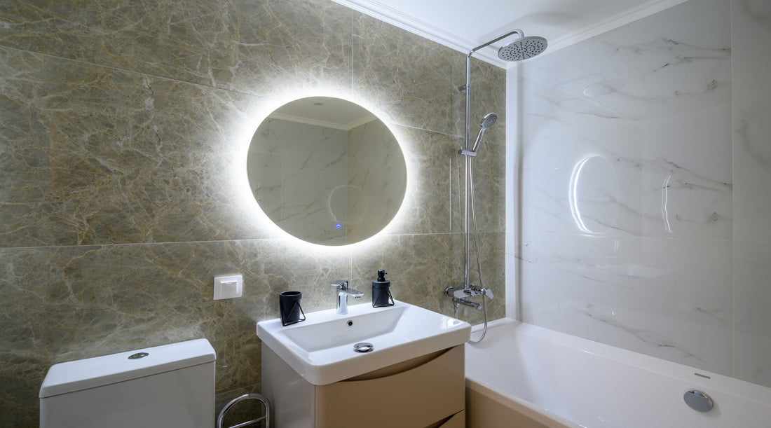Modern luxury marble bathroom with LED lights installed behind mirror