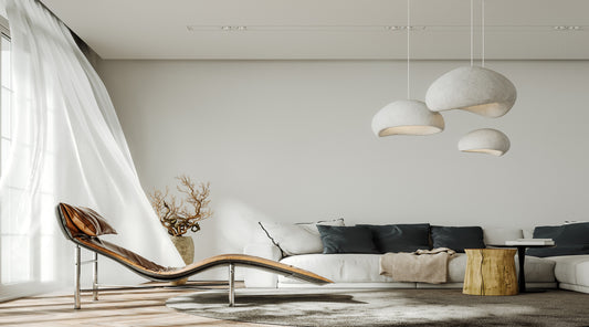 Natural light illuminating modern white interior with brown leather armchair