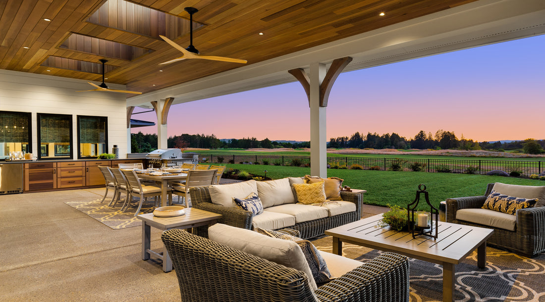 Outdoor ceiling fans underneath covered patio of luxury home