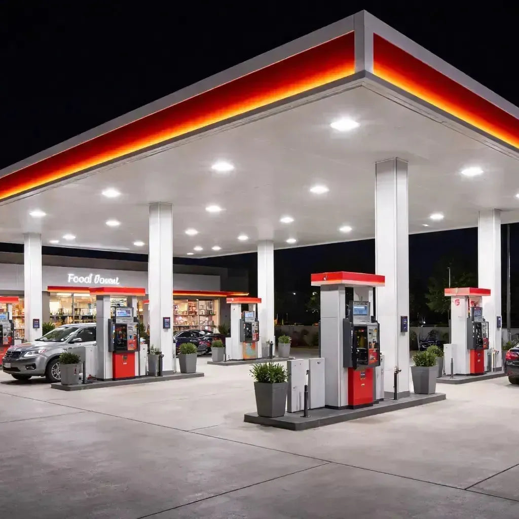 LED gas station and canopy lighting illuminating a modern commercial fuel station with uniform light across the forecourt and pump areas