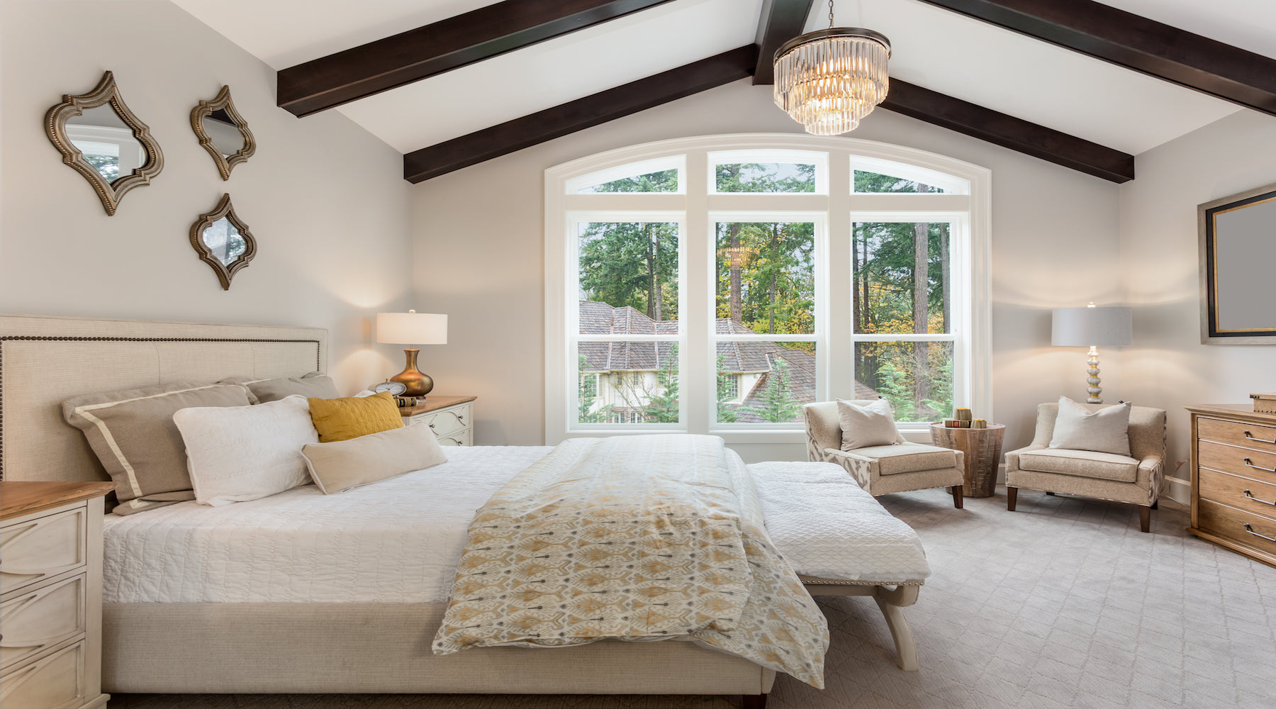 Bedroom lighting installed in large master bedroom with vaulted ceilings and wooden beams