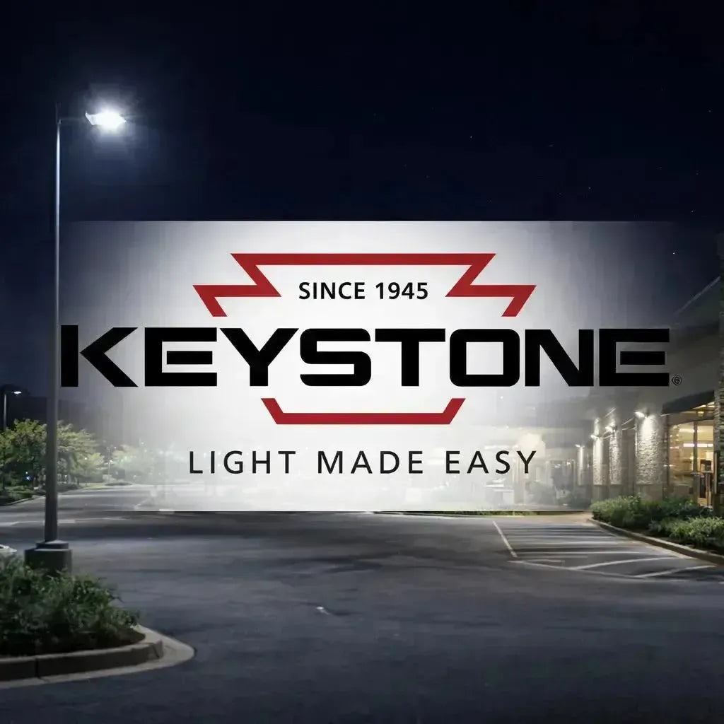 Keystone Technologies LED area lights and wall pack lighting used in a commercial outdoor parking lot at night