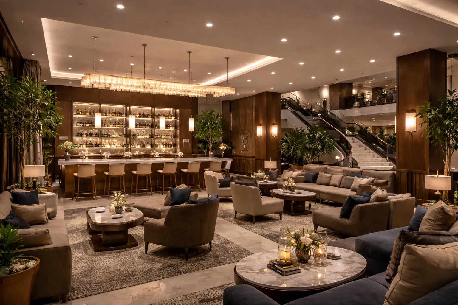 LED commercial recessed downlights and linear pendant lights illuminating a luxury hotel lobby and hospitality seating area with warm, balanced lighting