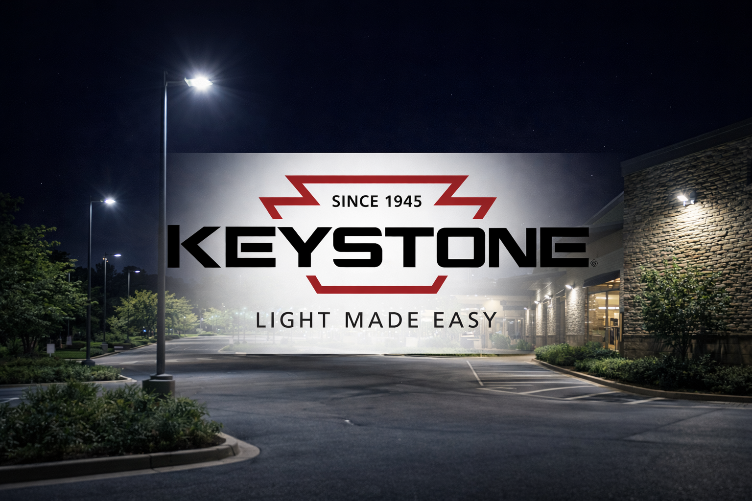 Keystone Technologies LED area lights and wall pack lighting used in a commercial outdoor parking lot at night