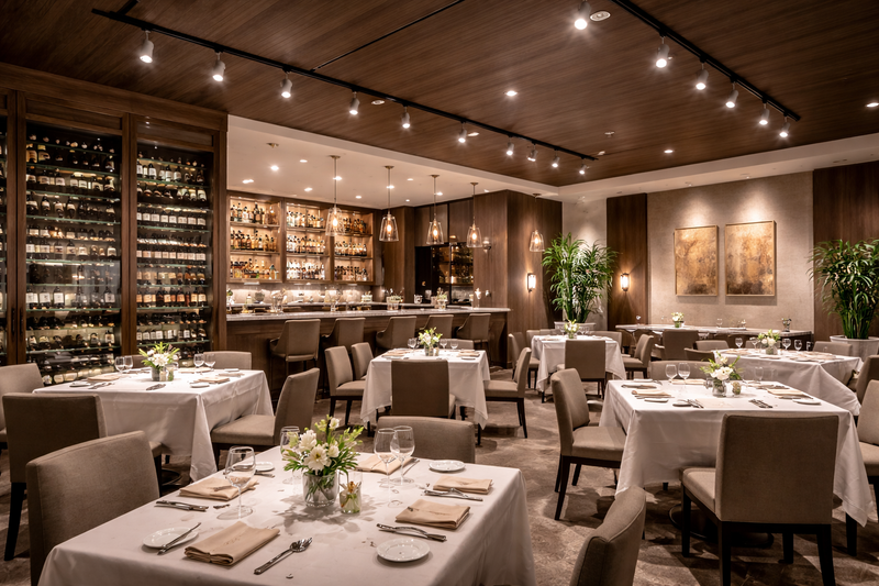PAR20 LED bulbs providing focused accent lighting in an upscale commercial restaurant with track-mounted fixtures and ambient dining areas