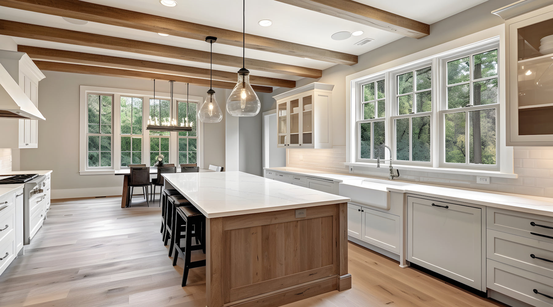 Pendant lights hanging over island in modern farmhouse style kitchen