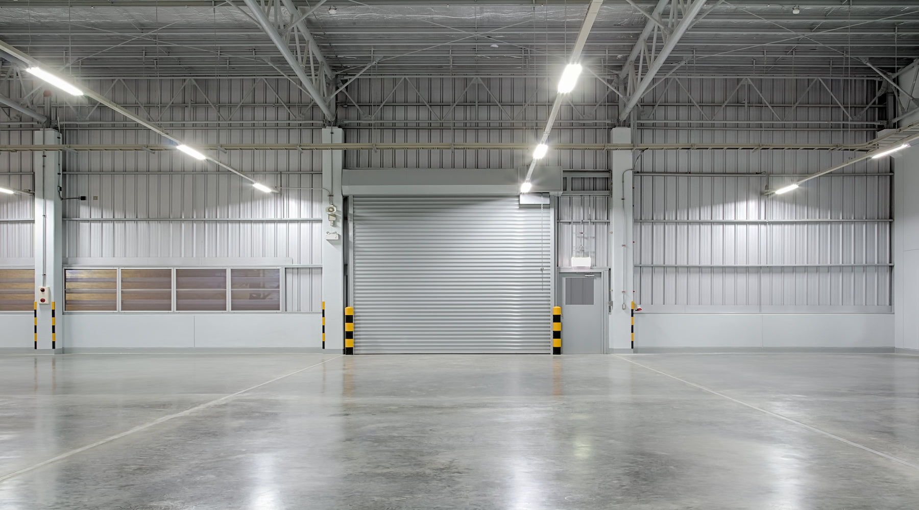 Strip light fixtures installed in a large warehouse