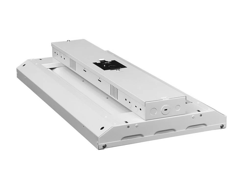 Angled back view of the 2ft LED linear high bay showing the wiring compartment/electrical box with multiple knockout locations (including a center knockout), plus CCT-select and wattage-select switches on the side of the box and the end mounting points; 110/135/160W, 13,500–21,600 lm, 3500K/4000K/5000K, 0–10V dimming, 120–277V.
