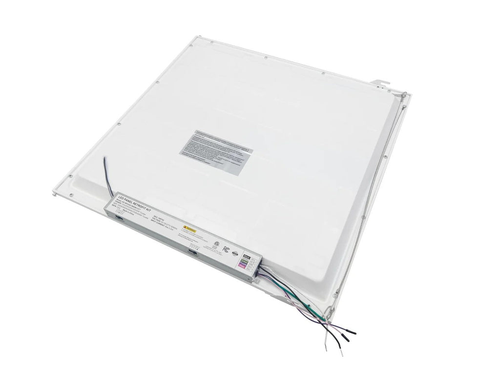 Back view of the 2×2 LED panel retrofit showing the safety cable, grid clips, and driver with CCT- and wattage-selectable dip/slide switches; black, white, green, and pink leads exit the end of the driver for field wiring, 15/20/25/30/40W, 1,950–5,000 lm, 3500K/4000K/5000K/5700K/6500K, 0–10V dimming, 120–277V.