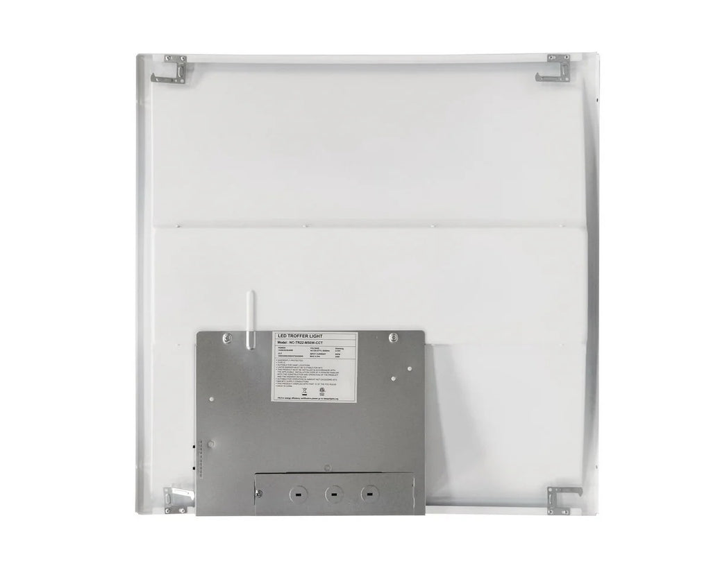 Back view of the 2×2 LED drop-ceiling troffer showing the wiring compartment with conduit knockout points, plus side-access CCT-select and wattage-select slide/DIP switches on the electrical box; 120–277V input, wattage-select 15/20/25/30/40W delivering 1,950–5,000 lumens with 3500K/4000K/5000K/5700K/6500K CCT options.