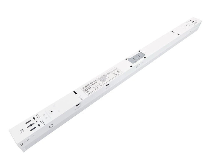 4ft LED strip light rear housing view showing the wiring compartment with knockout locations and integrated driver area, plus side-access CCT-select and wattage-select switches; 120–277V input with 0–10V dimming, 25/30/35/40/50W selectable delivering 3,750–6,500 lumens with 3500K/4000K/5000K/5700K/6500K options.