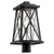 A black outdoor post light with a clear glass shade, featuring a timeless X-brace design. This Quorum International lamp is UL Listed for wet locations and has a 2-year warranty. 100W, 120V, medium E26 bulb base. Dimmable. No bulbs included. Dimensions: 9.25"W x 18.5"H.