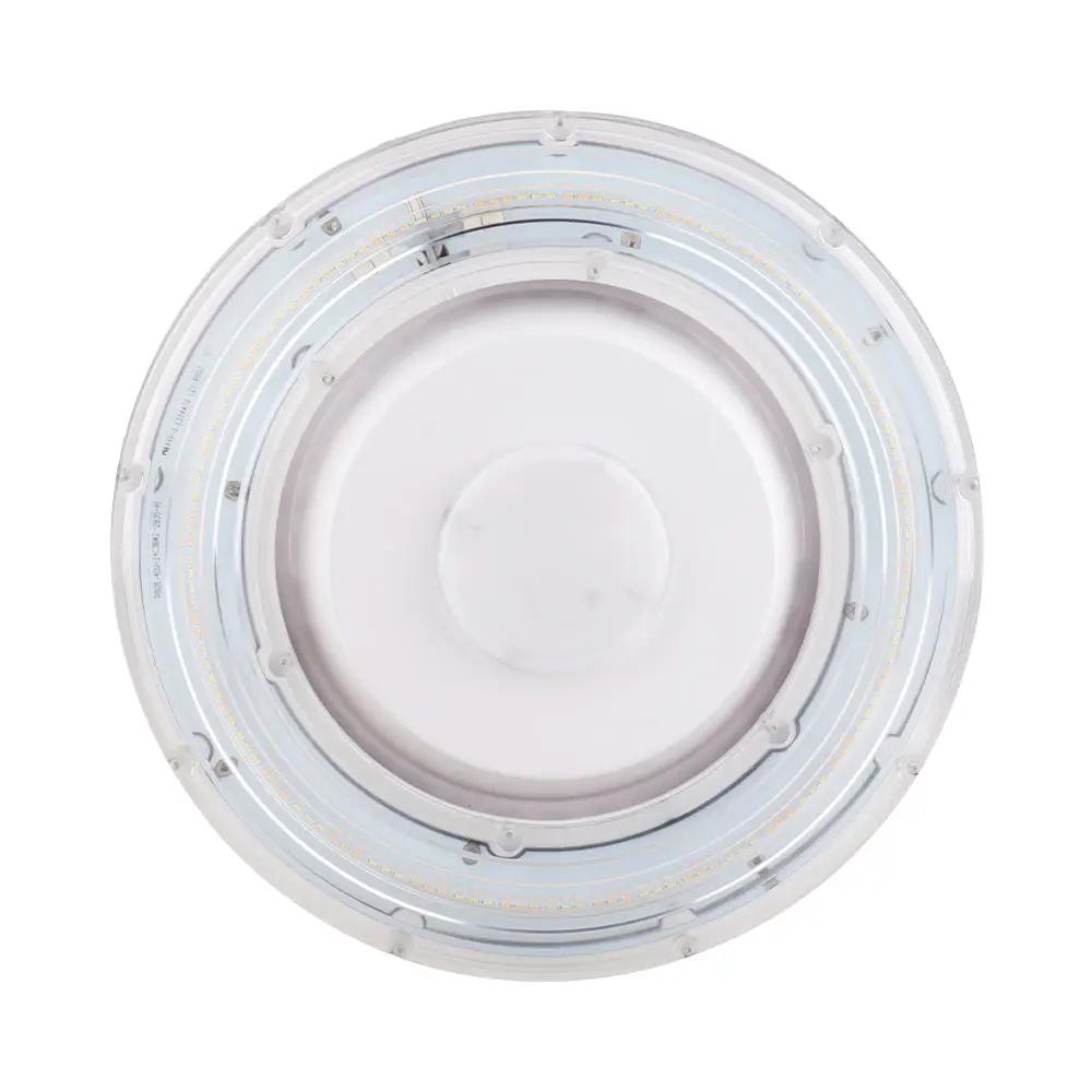 Underside view of the LED canopy light highlighting the lens assembly and capped center sensor port for optional control module connection; 55W, 6,975–7,700 lm, 3500K/4000K/5000K, 80 CRI, 0–10V dimming, IP65, 100–277V.