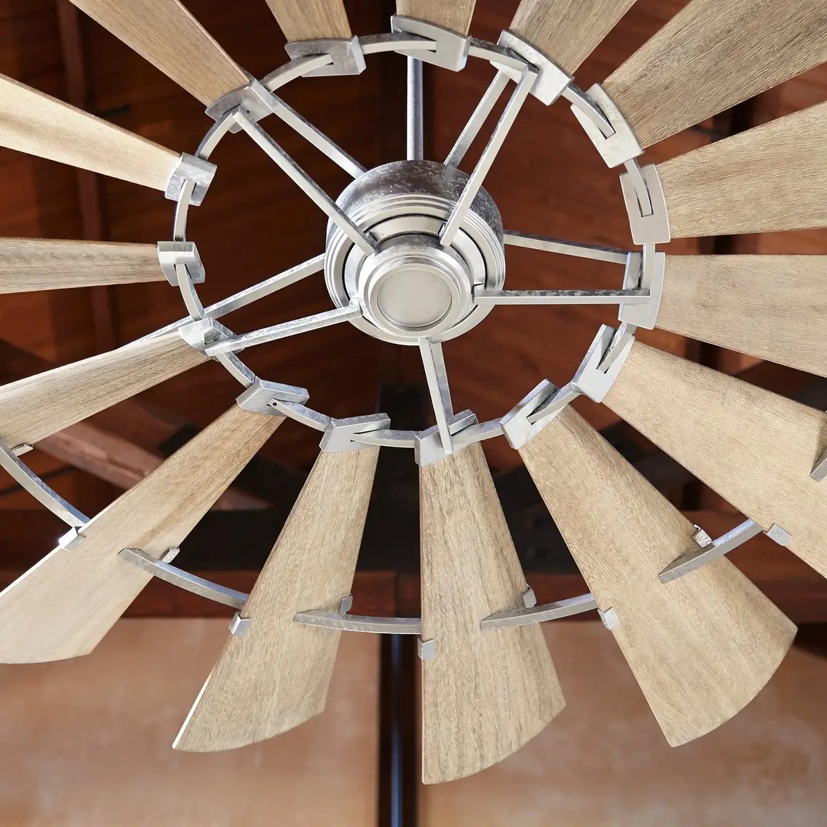 Farmhouse Ceiling Fan with 15 weathered oak wooden blades, rustic design, and windmill-inspired architecture. DC-165L motor, UL Listed, Dry Location safety rating. Dimensions: 16.5"H x 72"W. Limited Lifetime warranty.