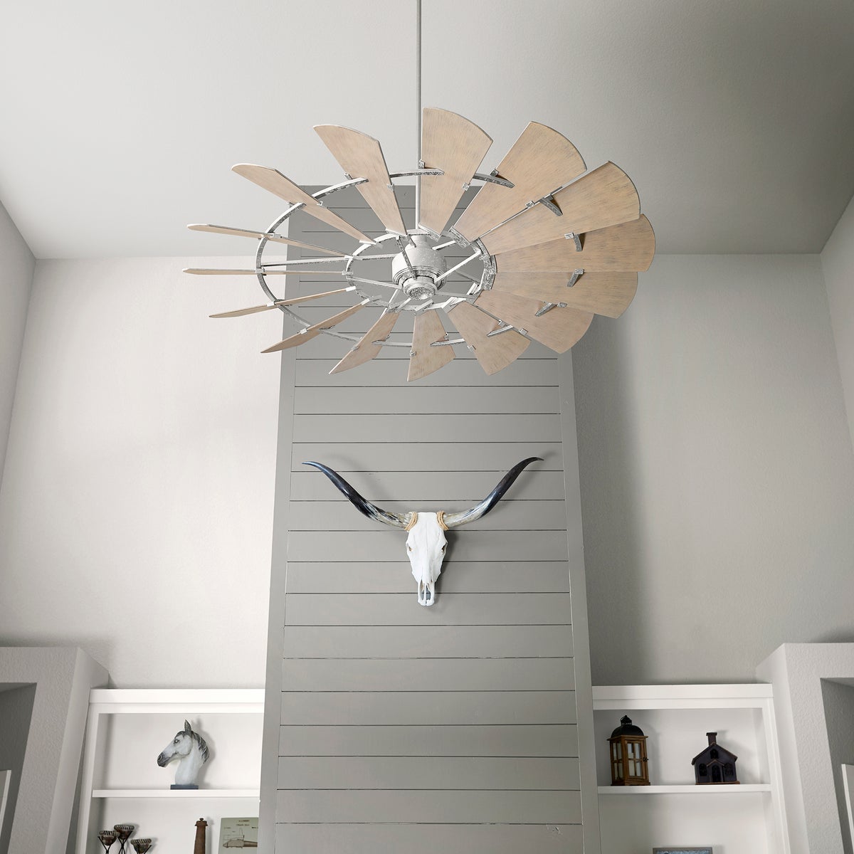 Farmhouse Ceiling Fan with rustic wooden blades and a weathered oak finish, complementing the country chic design. Incorporates the look of an outdoor windmill.