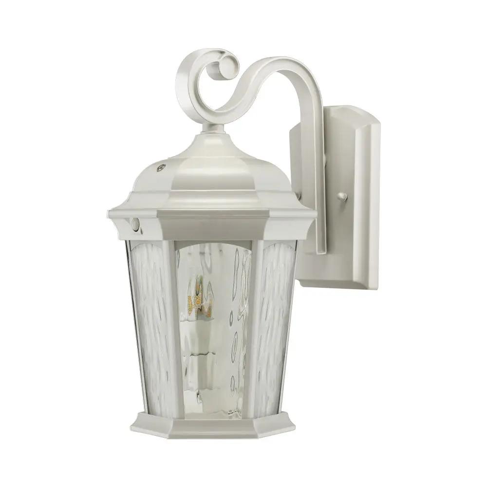 A white outdoor wall lantern with a flickering flame bulb and water glass. Motion sensor detection and dusk to dawn technology.