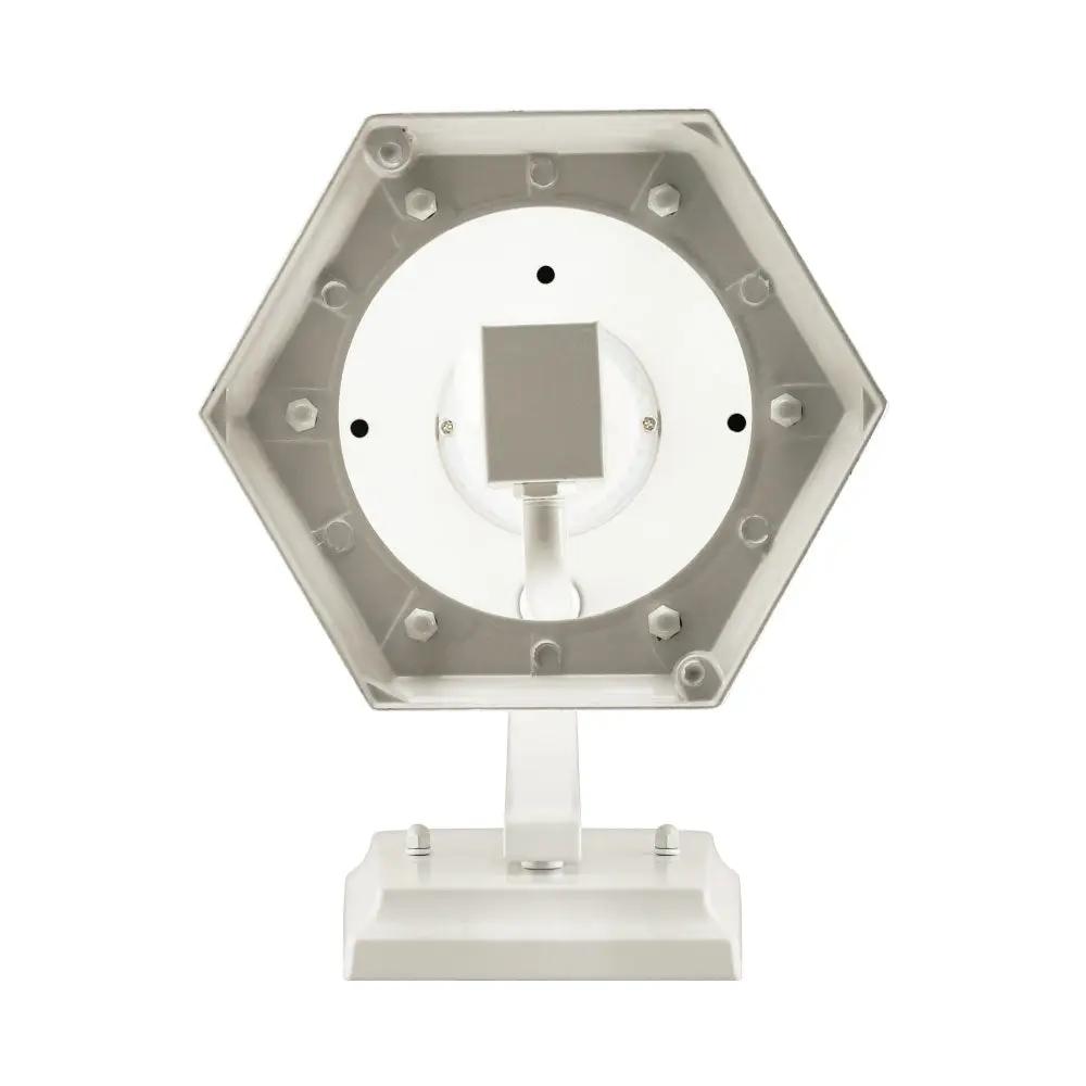 A white hexagon-shaped light with screws, designed with dusk to dawn technology, motion sensor detection, and an enclosed flame bulb programmed with over 300 LEDs. This flickering flame lantern offers safety, security, and aesthetic appeal with water glass, a beautiful finish, and swooping S-hook arm.