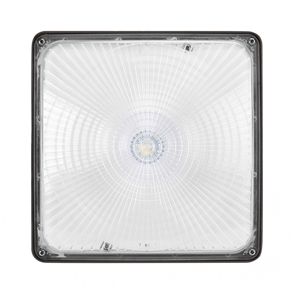 Bottom view of an IP65 LED canopy light showing the lens and housing profile; 40W output with 5,450 lumens, 120–277V.