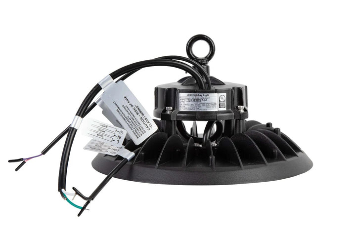 Side view of the LED UFO high bay showing the ring bolt hanging point, heat-sink fins, and the power cord exiting the top; 100/125/150W, 15,000–22,500 lm, 4000K/5000K/5700K, 0–10V dimming, 120–277V.