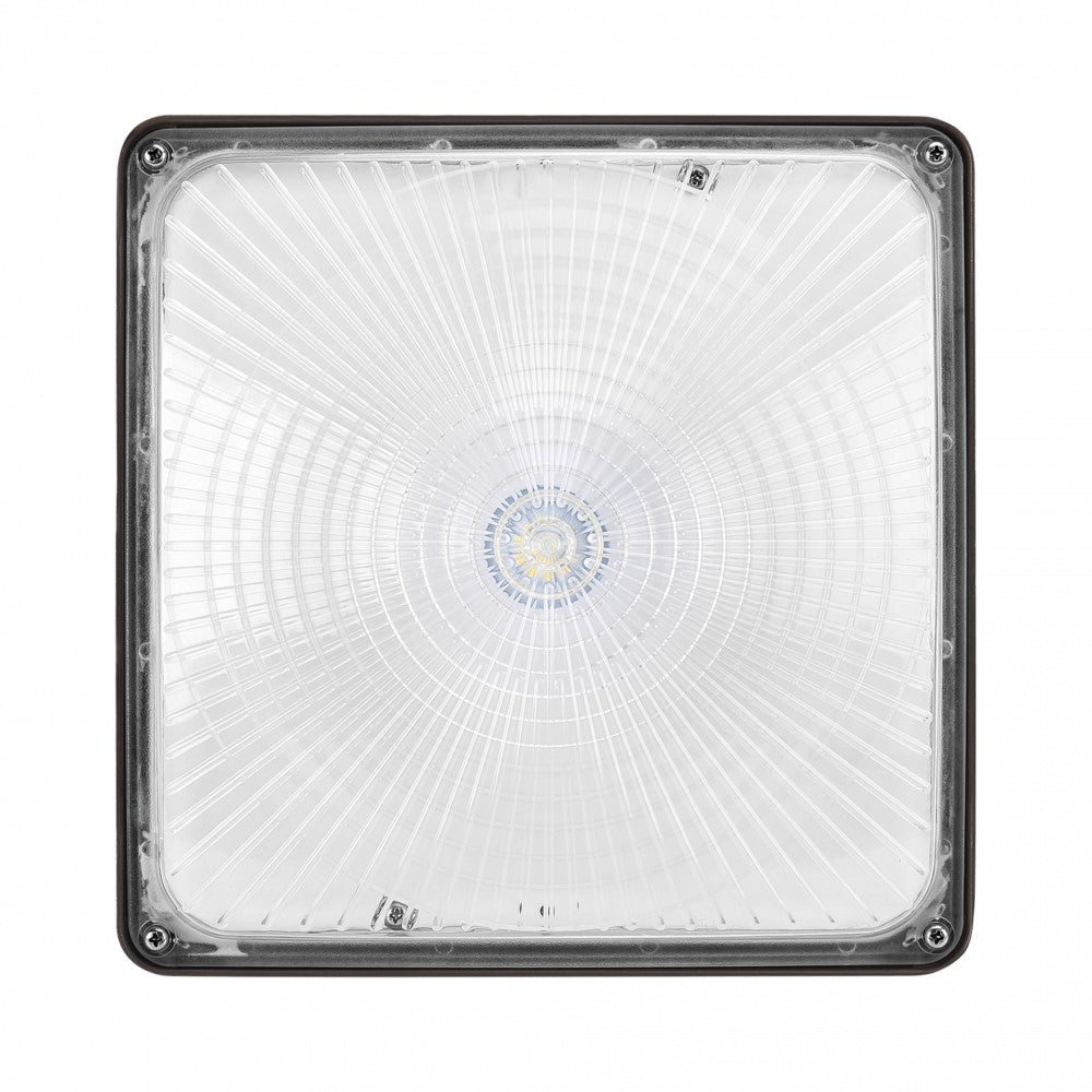 A close-up of SLG Lighting's Light Canopy, showcasing its high lumen output and weatherability. Provides 8000 lumens with a polycarbonate lens for reduced yellowing and precise light direction. UL Listed, FCC Compliant, RoHS Compliant, IP65 Rated, DLC Premium Listed.