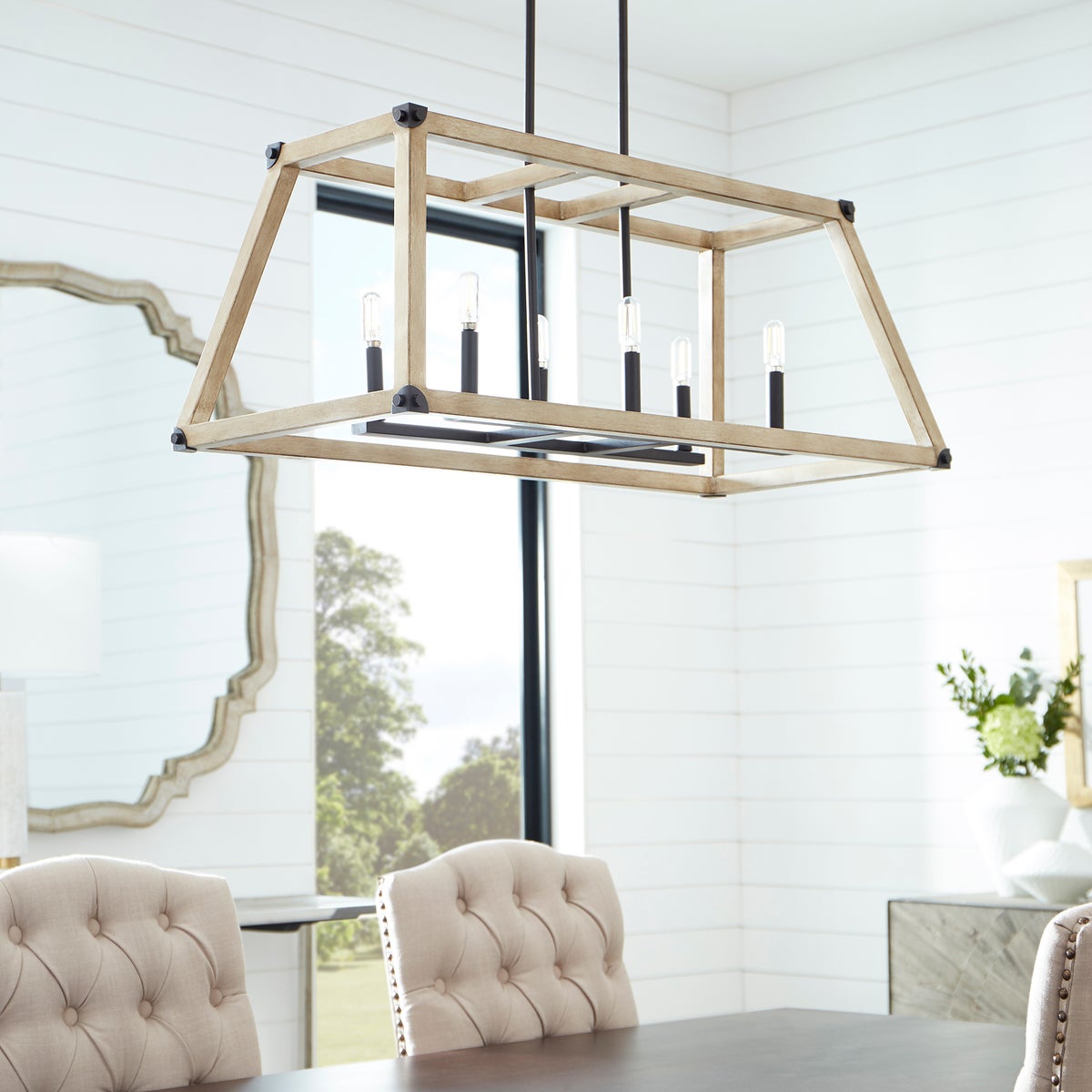 Linear Chandelier with driftwood/noir finish and exposed candelabra bulbs, exuding farmhouse charm. Perfect for rustic style applications.