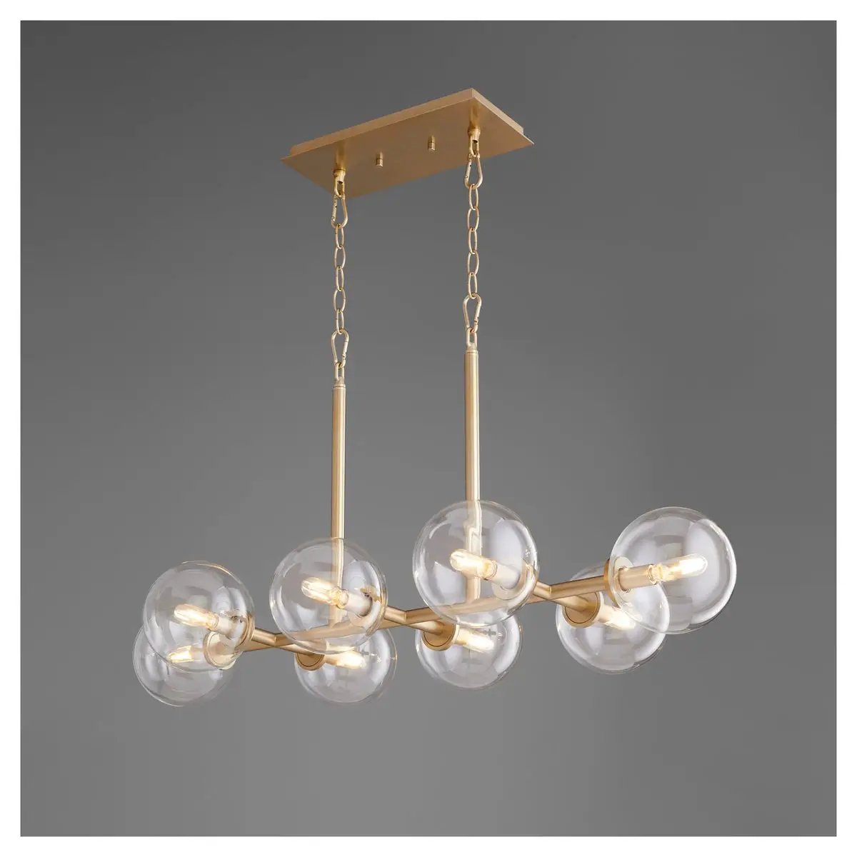 Linear Sputnik Chandelier with clear glass balls, aged brass frames, and mid-century modern appeal. Dramatic and charming lighting fixture for any environment. Wow your guests with this brilliant design.