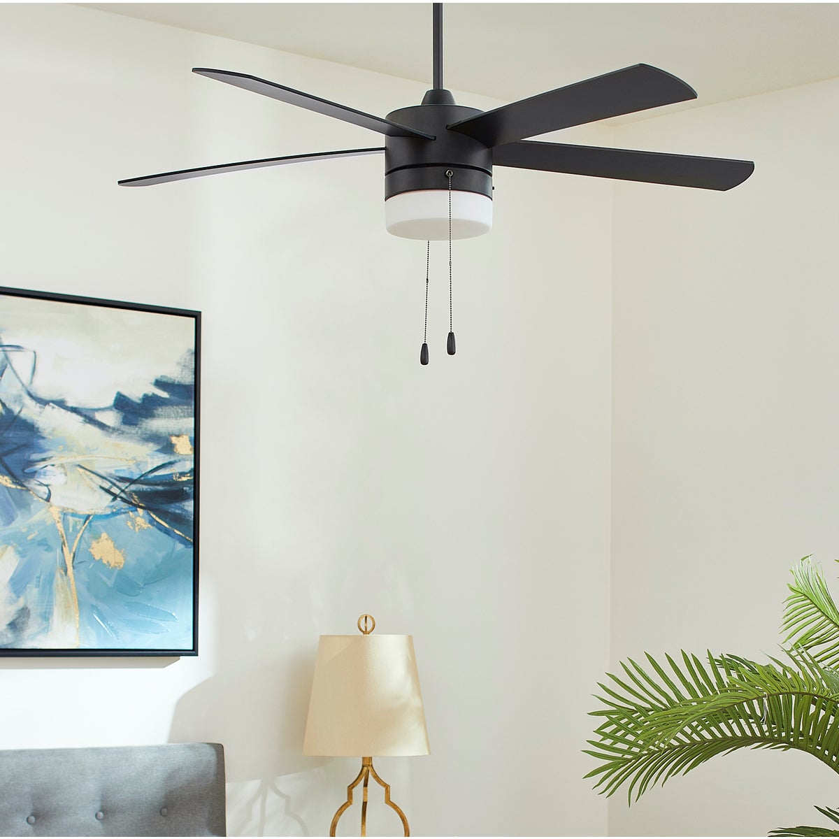 A mid century modern ceiling fan with five blades and a translucent lighting shade, designed for efficient air circulation. 52" sweep.