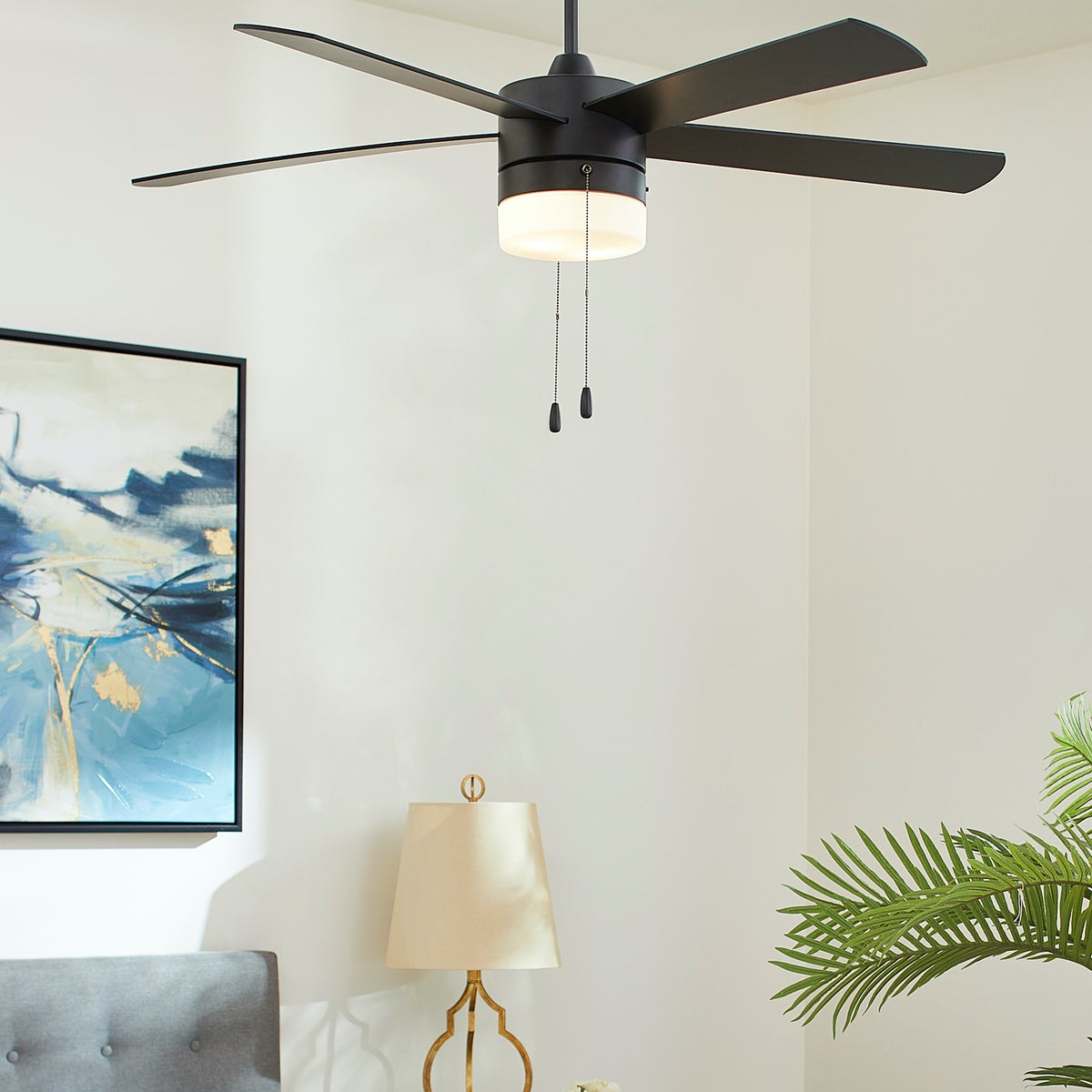 A mid century modern ceiling fan with a monochrome finish and a translucent lighting shade, designed for efficient air circulation. This 52" sweep fan effortlessly provides cooling comfort to your home.