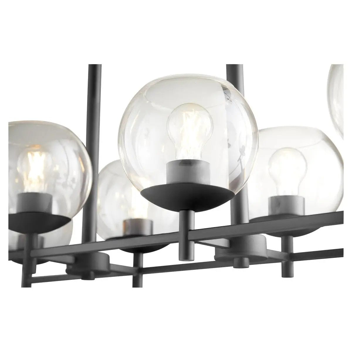 Mid Century Modern Island Lighting: A close-up of a chandelier with rounded, clear casings around its lights, creating a subtle and stylized look. This matte black fixture features strong angles and bold lines, complemented by more rounded profiles. Perfect for dining rooms, kitchens, and outdoor spaces.