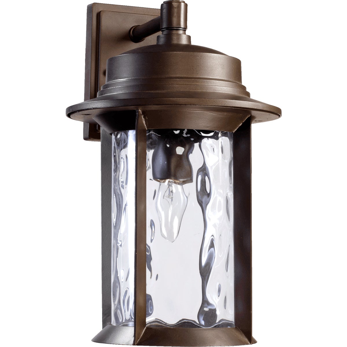 A mid century modern outdoor wall light with a clear glass shade and hammered glass panes. Made from durable metal, it features a clean-lined drum silhouette and a simple backplate. Fits a single dimmable 100W bulb (not included).
