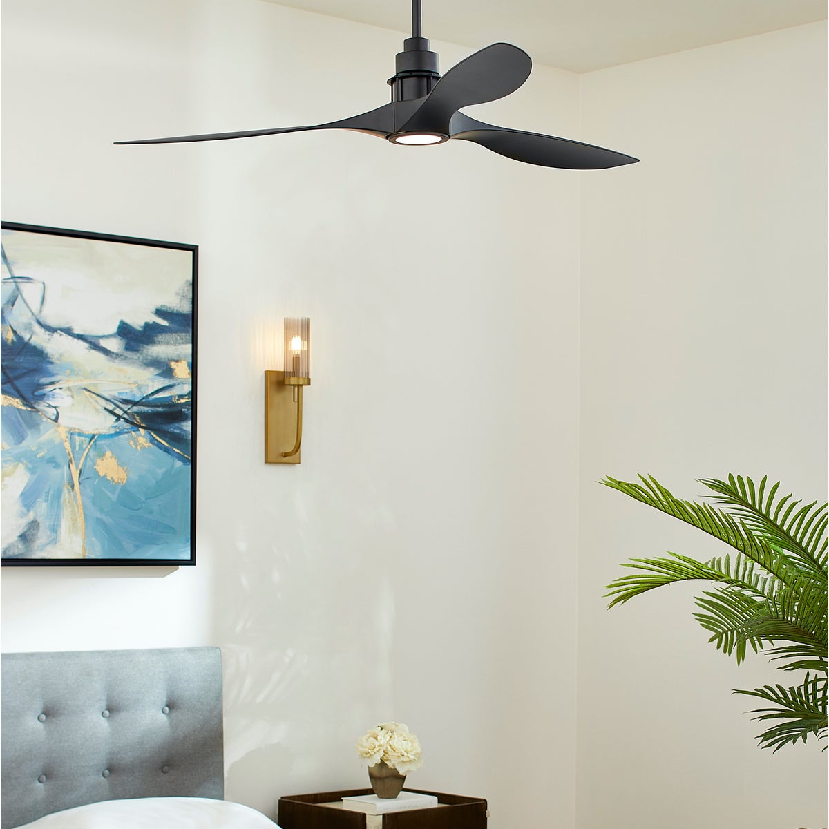 A sleek, modern ceiling fan with light in matte black finish. Features a trio of monochromatic blades for powerful air circulation. Perfect for any interior space.