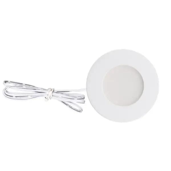 A white circular puck light with a wire, providing 170 lumens of bright, slim-sized lighting for undercabinet or small area applications. Can be recessed or surface mounted, and easily connected using a 6-port hub. Swap trim colors (white, black, brushed nickel) with magnetic technology. CRI of 90+ for true color rendering.