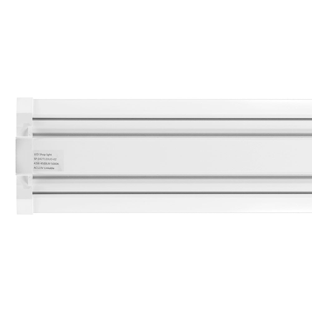Shop Light: A white rectangular object with a label, providing 4300 lumens of 5000K white light. Ideal for garages, workshops, and warehouses. Linkable with a 5-foot connecting wire and 6-inch connector. Maximum run of 40-feet. LED, 42 Watts, 120V. UL Listed, Damp Location. 47.08"L x 5.88"W x 2.75"H. 5-year warranty.
