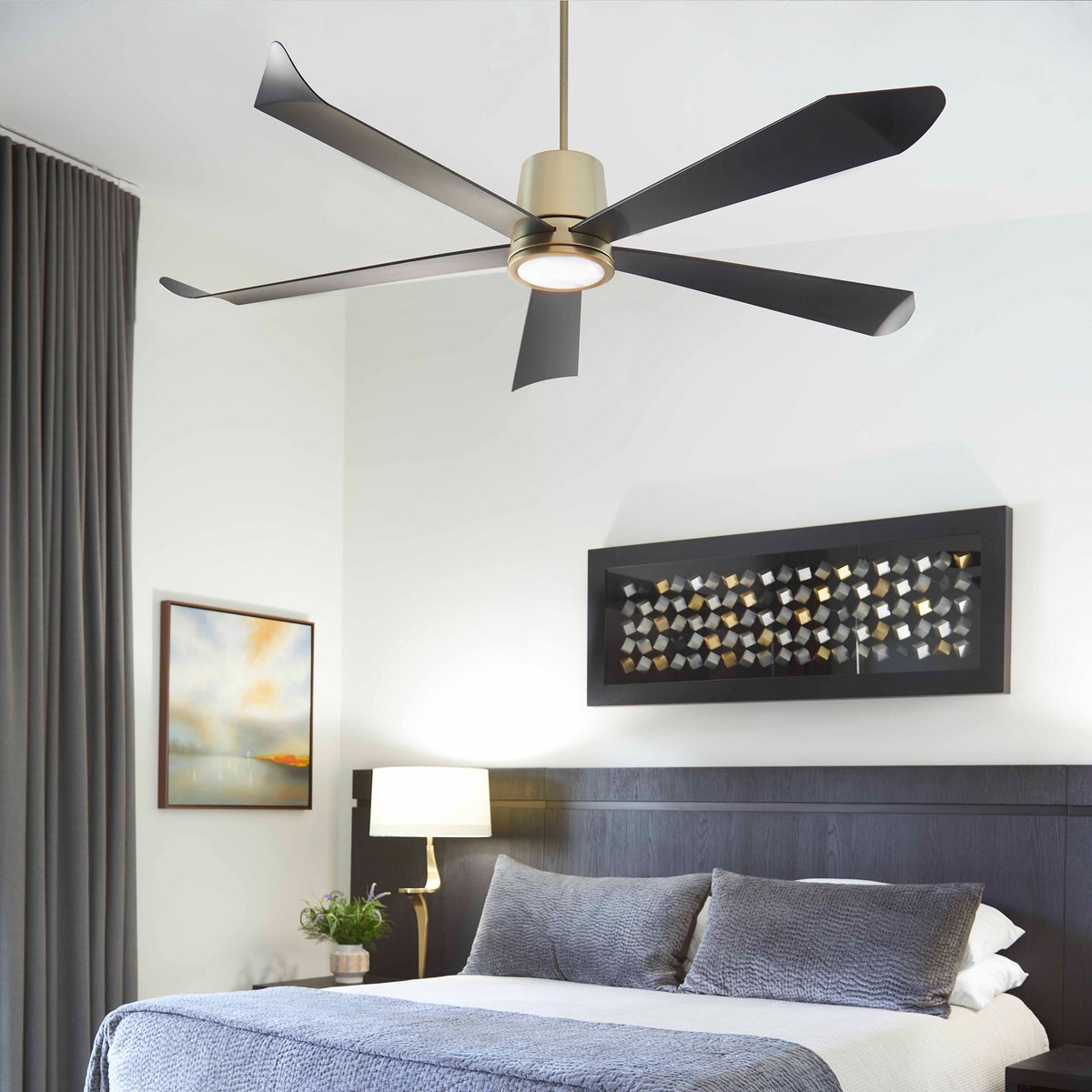 A smart ceiling fan with elongated blades and optional light kits. Perfect for living rooms, home offices, or bedrooms. Brand: Quorum International. Motor Size: DC-165NM. Watts: 26/19/15/11/8/5. Amps: .30/.24/.20/.15/.11/.08. RPMs: 90/82/74/60/59/52. Number of Blades: 5. Blade Pitch: 13 Degrees. Certifications: UL Listed. Safety Rating: Damp Location. Finish: Aged Brass, Matte Black, Satin Nickel, Studio White. Dimensions: 15"H x 72"W. Warranty: Limited Lifetime.