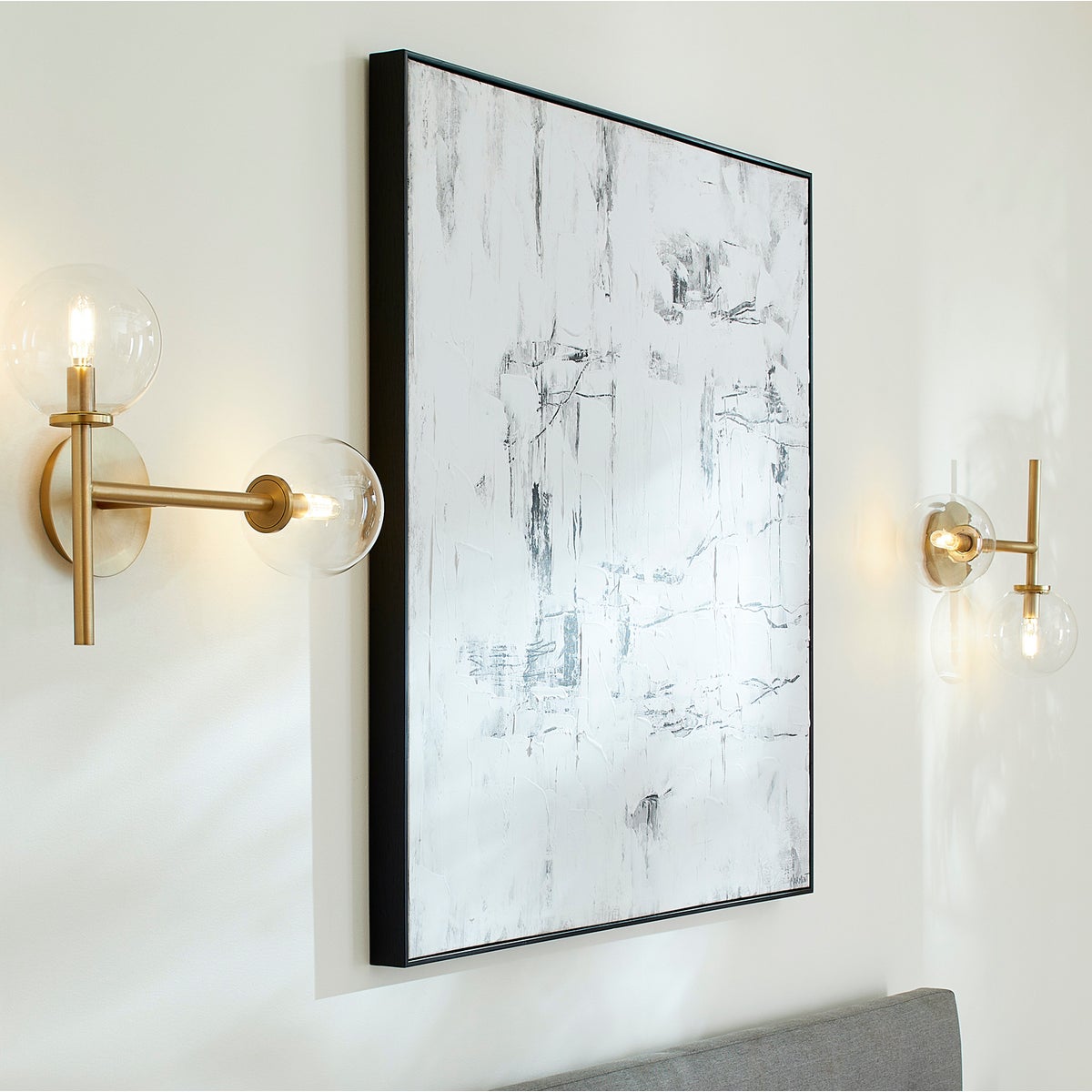 Sputnik Wall Sconce with clear glass domes and aged brass frames, adding mid-century modern appeal. Enhance your environment with this brilliant mid century design.