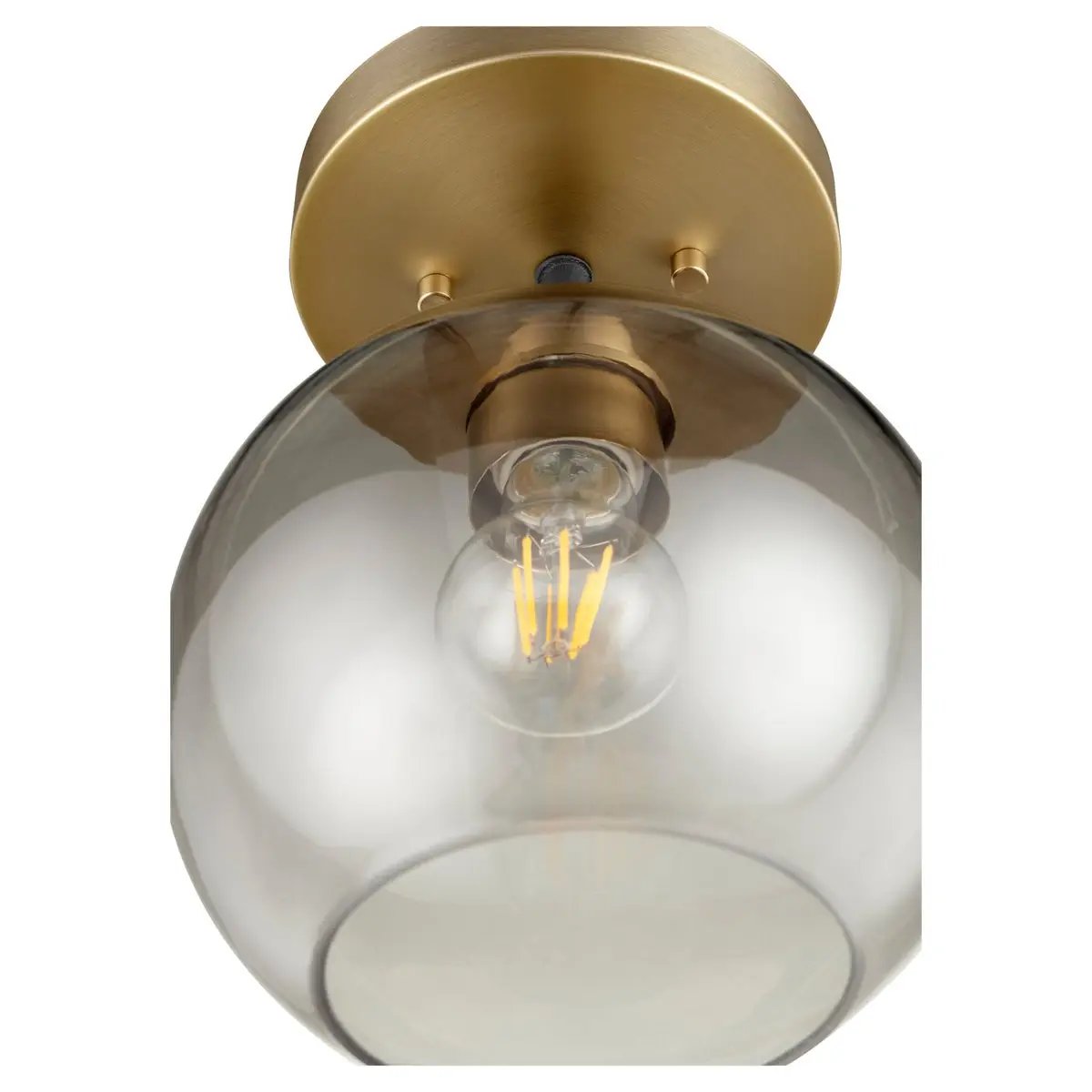 Transitional flush mount lighting with clear glass shade and elegant finishes. Soft diffusion of light for a glowing radiance.