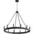 A black chandelier with lights, featuring a wagon wheel design. This farmhouse-inspired fixture combines industrial aesthetics with a beautiful finish. Customize the look with candle sleeves in aged brass, noir, or satin nickel. Elevate your space with the Aura wagon wheel chandelier from Quorum International.