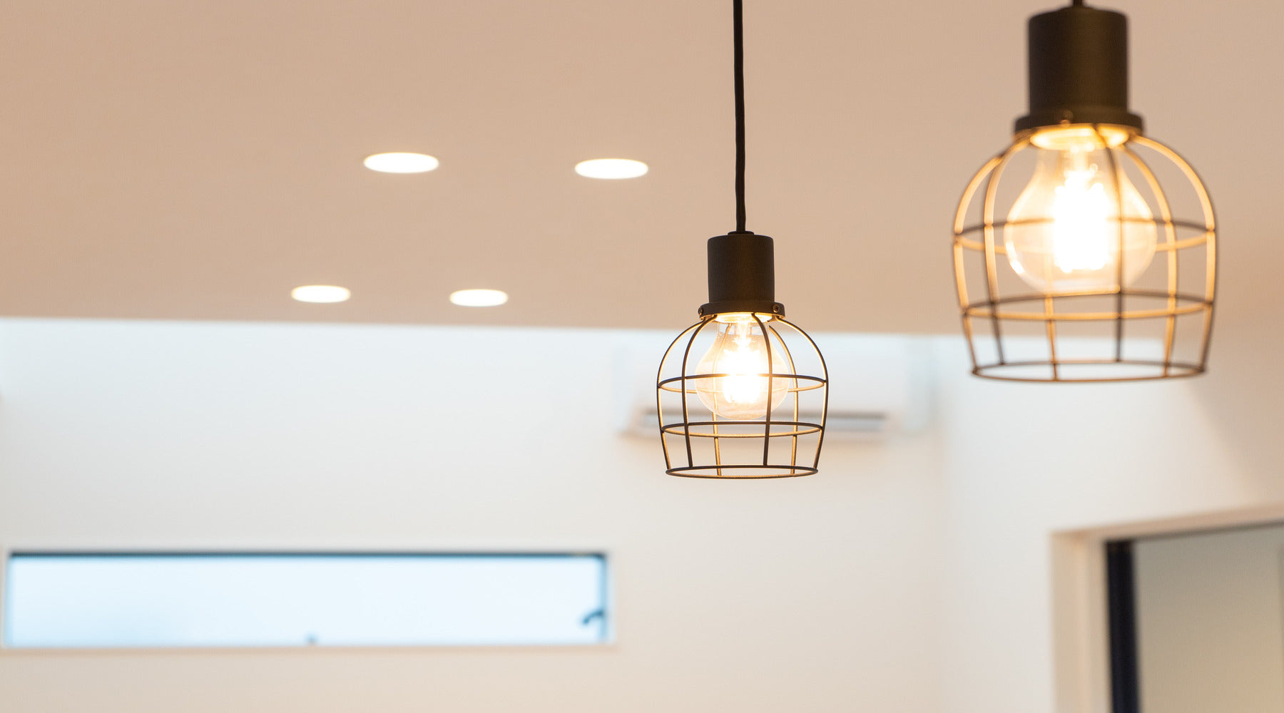 BR30 LED bulbs shown in recessed cans in living area with pendant lights