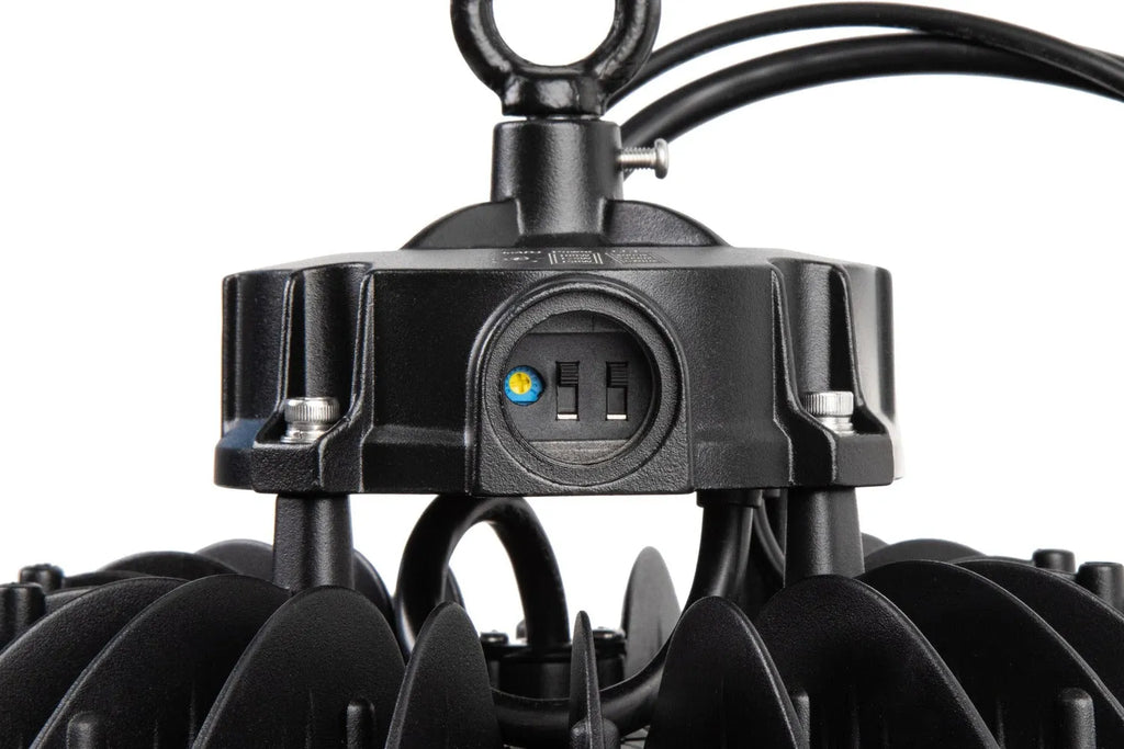 Halo X Series LED UFO high bay with driver compartment open showing wattage and CCT selectable dip switches for field configuration