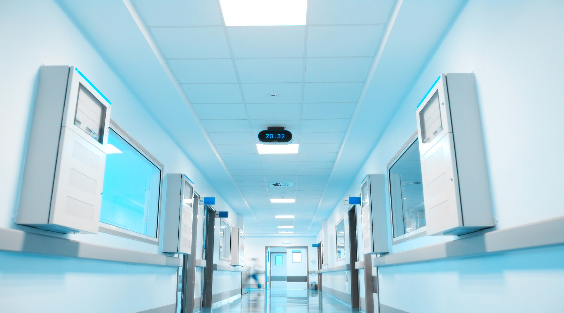 T5 LED bulbs used in drop ceiling fixtures inside hospital corridor