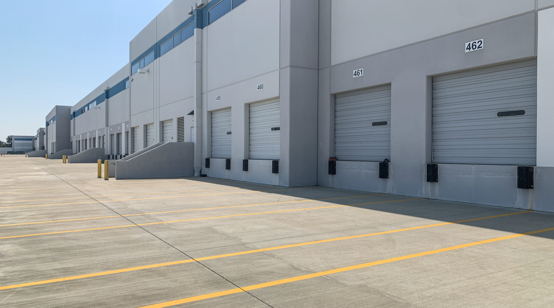 Wall packs shown on industrial building with shipping and receiving area